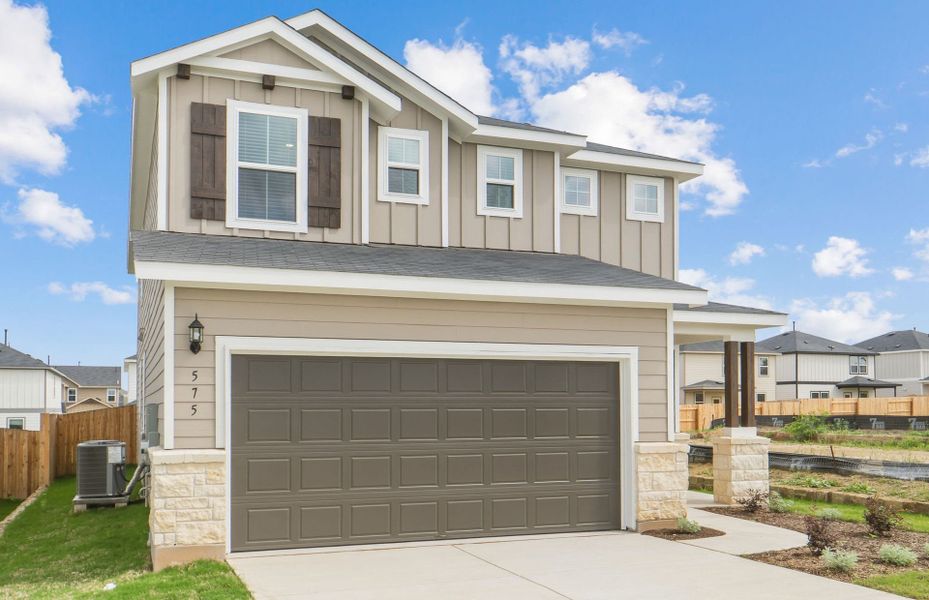 Front exterior of a new home in Sunfield, Buda, TX, highlighting curb appeal (Image 18).