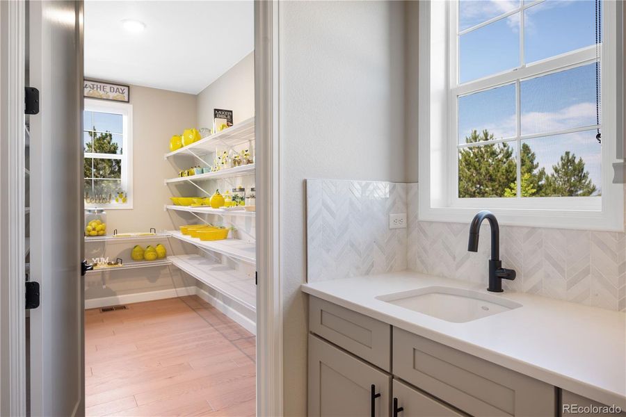 Butlers Pantry with sink and access to Formal Dining Room