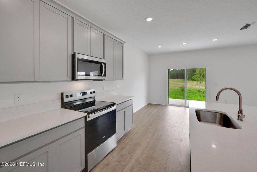 Furnished interior view inside a new home in Amberly, Green Cove Springs (Image 5).