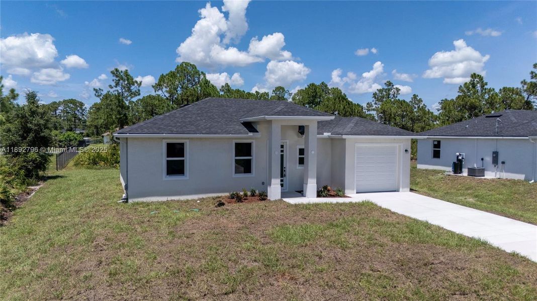 Exterior details and patio area of a home in , Lehigh Acres (Image 15). Exterior details and patio area of a home in , Lehigh Acres (Image 15).