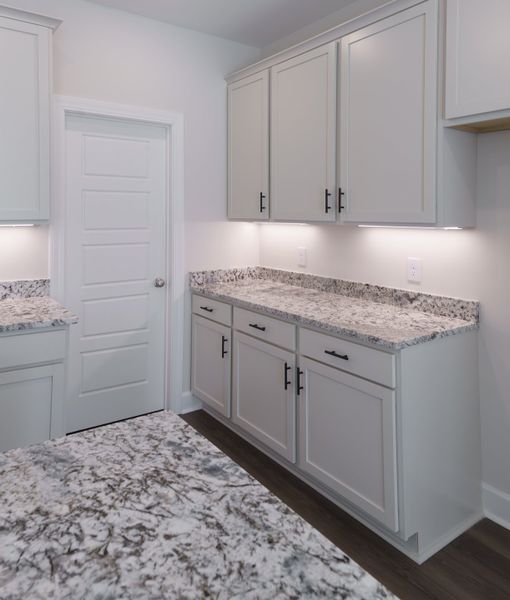 Representative furnished interior of a home built from the The Ivory by Cothran Homes in Holly Ridge, Greenville (Image 11).