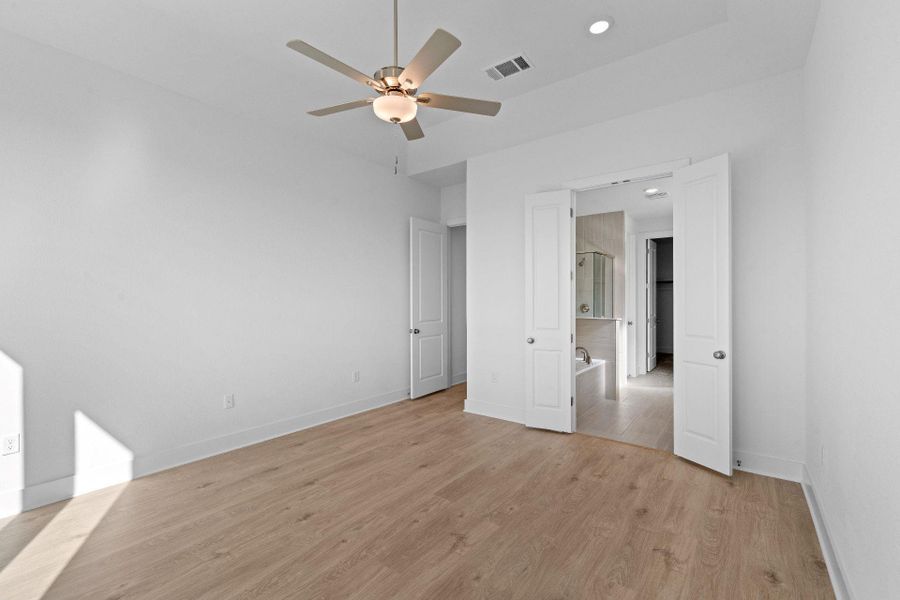 Primary Bedroom with elevated ceiling