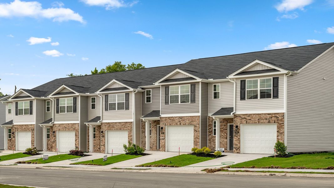 Front exterior of a new home in Edinborough Townes, Gibsonville, NC, highlighting curb appeal (Image 1).