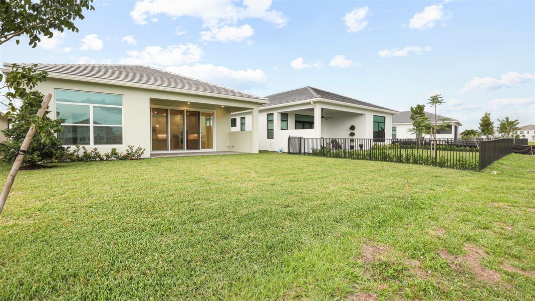 Exterior details and patio area of a home in Cresswind Palm Beach at Westlake, Westlake (Image 4).