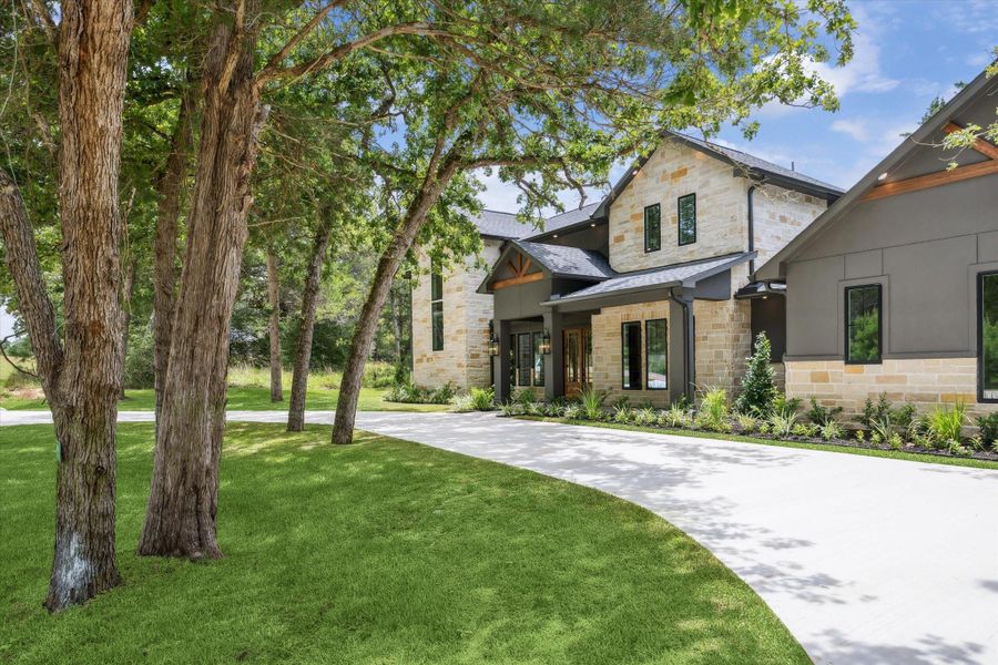 Front exterior of a new home in , New Ulm, TX, highlighting curb appeal (Image 24). Front exterior of a new home in , New Ulm, TX, highlighting curb appeal (Image 24).