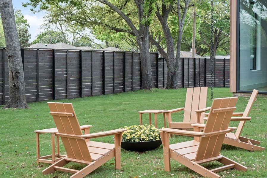 The private backyard offers space to relax, entertain, and unwind