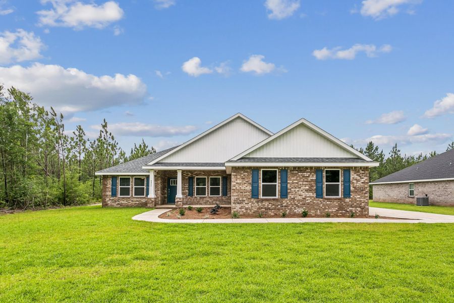 Representative exterior photo of a completed home built from the The Sapphire Estate by Herbst Homes in Walther Reserve, Milton, FL (Image 17).
