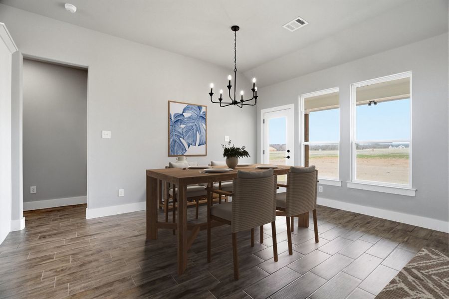 Representative furnished interior of a home built from the The Petunia by Kenmark Homes in Zion Valley, Poolville (Image 6).