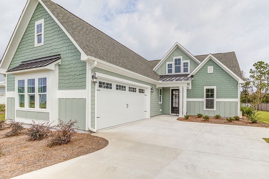 Representative exterior photo of a completed home built from the The Amherst by RobuckHomes in Windwater, Hampstead, NC (Image 26).