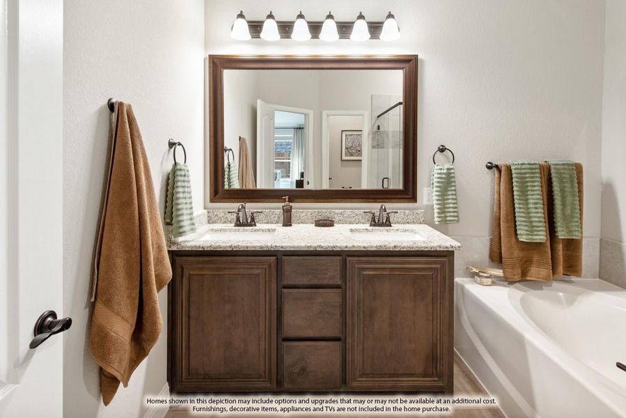 Bathroom with double-sink vanity, dark wood cabinets, granite countertop, large mirror, and five-bulb light fixture above.