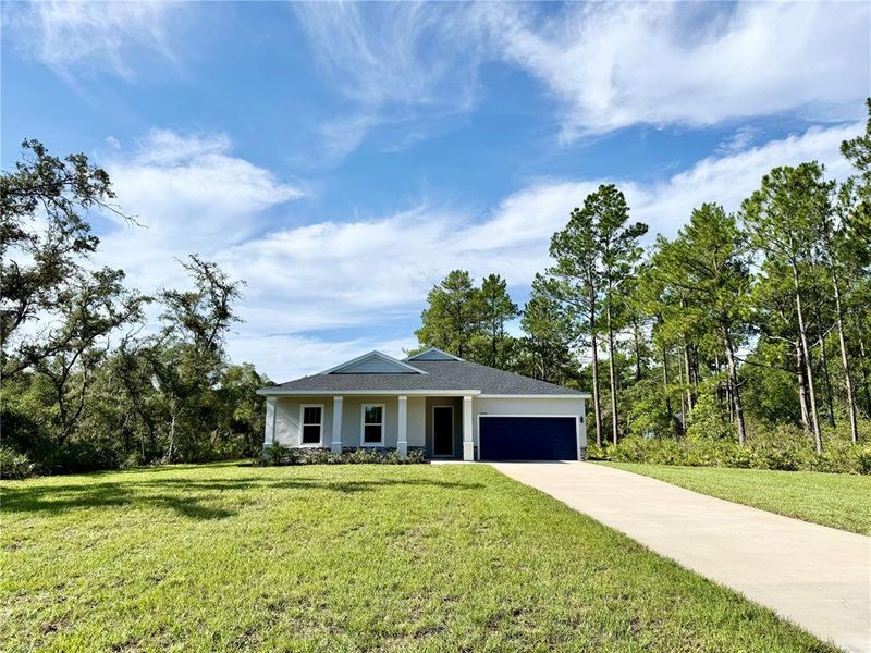 Front exterior of a new home in , Eustis, FL, highlighting curb appeal (Image 17). Front exterior of a new home in , Eustis, FL, highlighting curb appeal (Image 17).