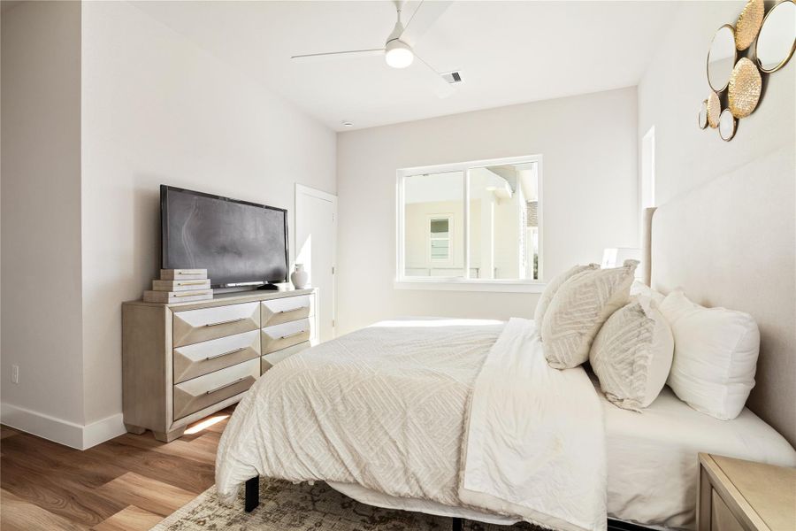 An additional view of the primary suite reveals the secondary closet, thoughtfully separated to keep storage organized without sacrificing the room’s clean, uncluttered feel.