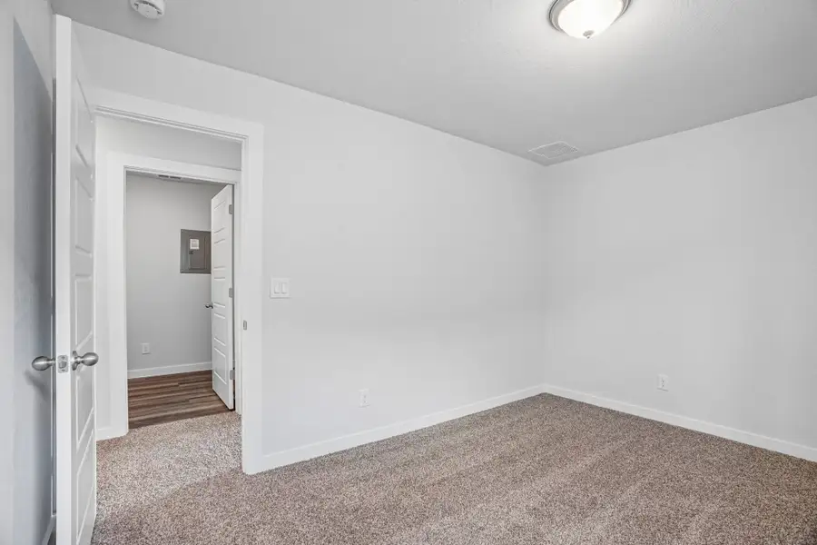 Spacious, unfurnished interior of a new home in The Meadows at Hunters Ranch, San Antonio (Image 38).