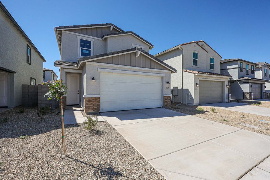 Front exterior of a new home in North Copper Canyon, Surprise, AZ, highlighting curb appeal (Image 1). Front exterior of a new home in North Copper Canyon, Surprise, AZ, highlighting curb appeal (Image 1).