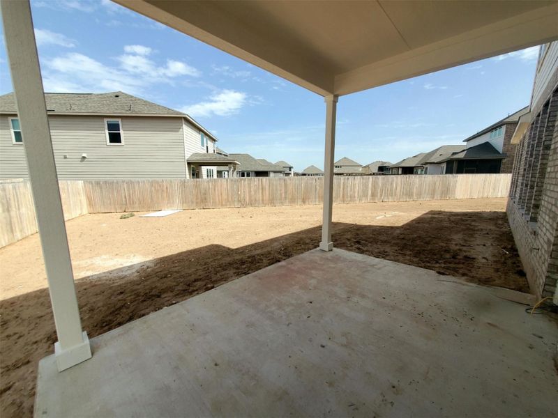 View of patio with a fenced backyard