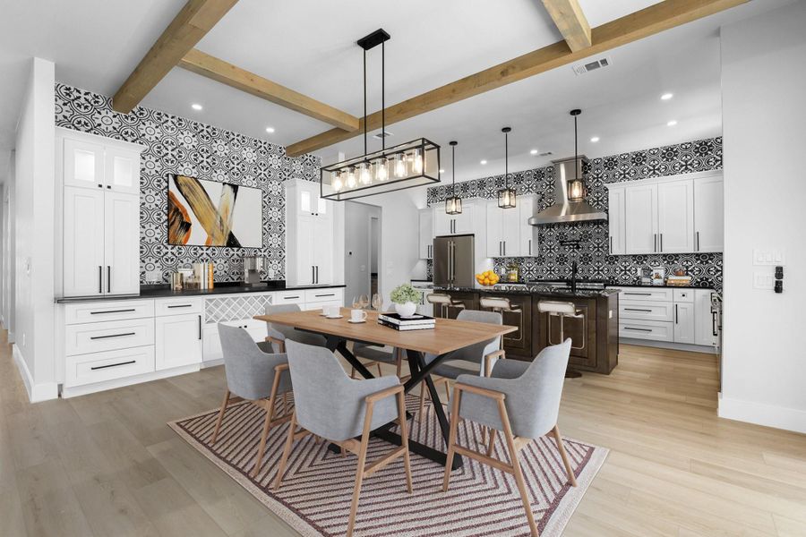 Dining space with beam ceiling, light wood finished floors, recessed lighting, and baseboards Dining space with beam ceiling, light wood finished floors, recessed lighting, and baseboards