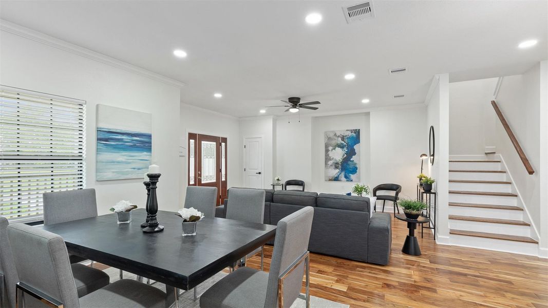 Picture hosting friends in this open-concept layout—where the kitchen flows seamlessly into the dining and living areas.