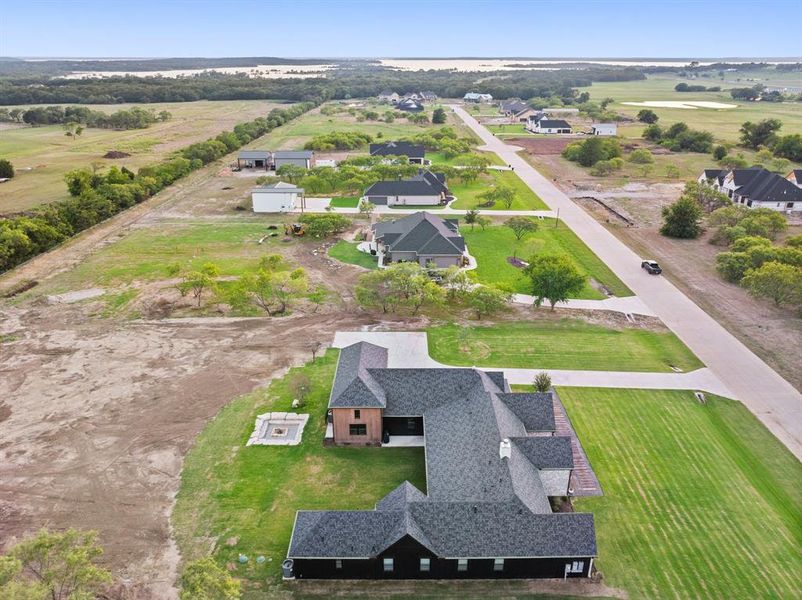 Birds eye view of property with a rural view