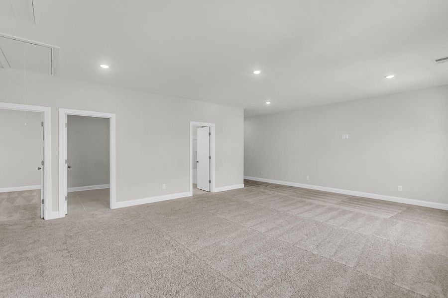 Spacious, unfurnished interior of a new home in Tidewater at Lakes of Cane Bay, Summerville (Image 56).