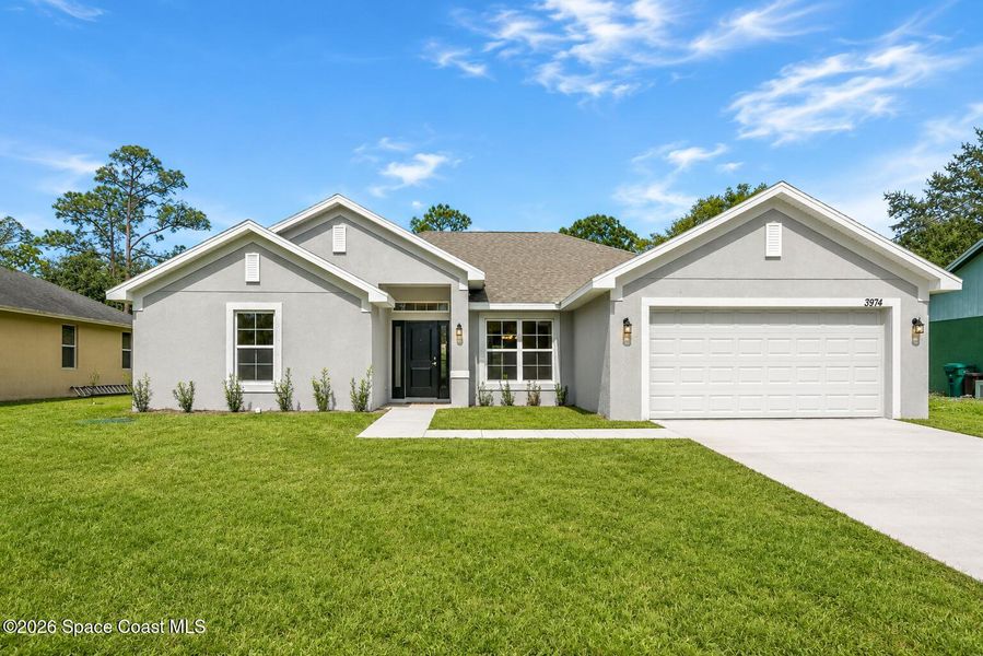 Front exterior of a new home in Palm Bay, Palm Bay, FL, highlighting curb appeal (Image 1). Front exterior of a new home in Palm Bay, Palm Bay, FL, highlighting curb appeal (Image 1).