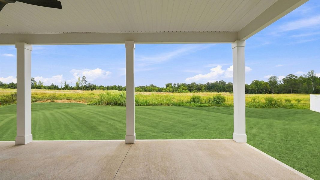 Warm and inviting outdoor living space with a covered rear porch and tasteful finishes Warm and inviting outdoor living space with a covered rear porch and tasteful finishes