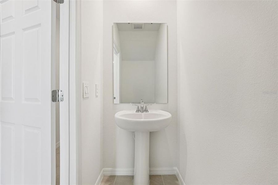 Furnished interior view inside a new home in Cagan Crossings West, Clermont (Image 9).