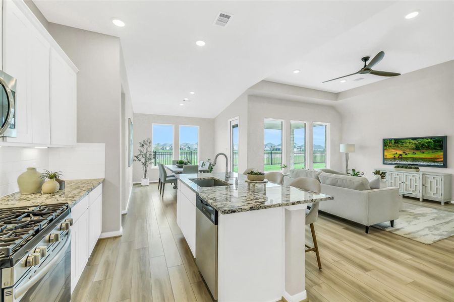 Kitchen view highlighting the open layout, perfect for entertaining with sightlines to the lake and living room.