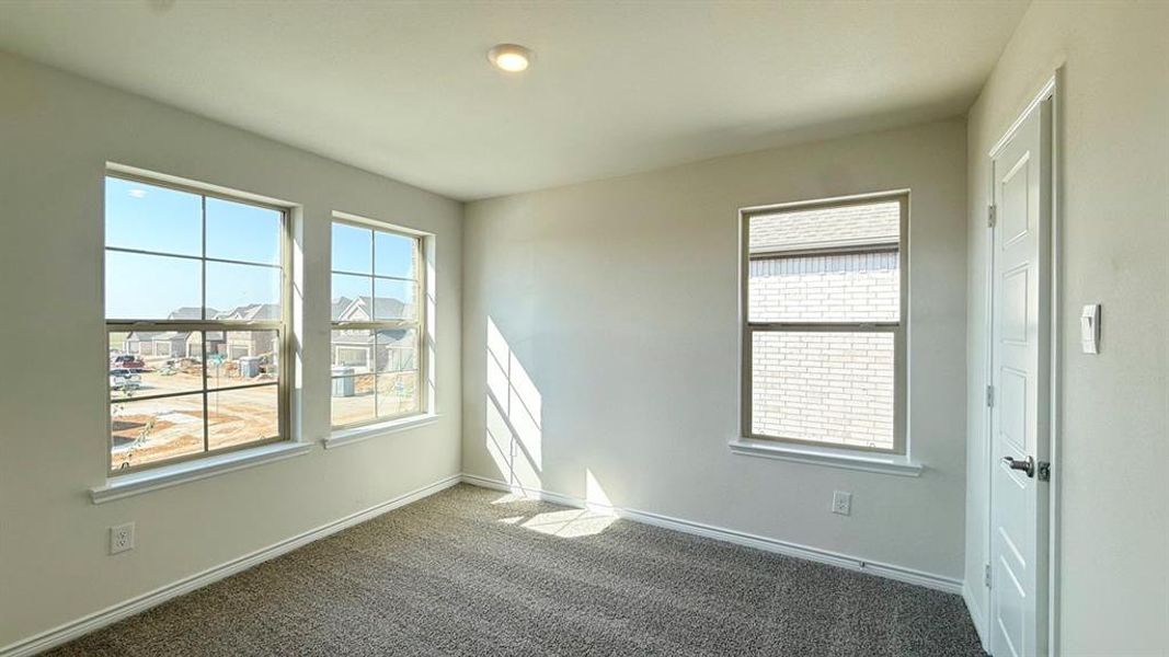 Carpeted spare room with healthy amount of natural light Carpeted spare room with healthy amount of natural light