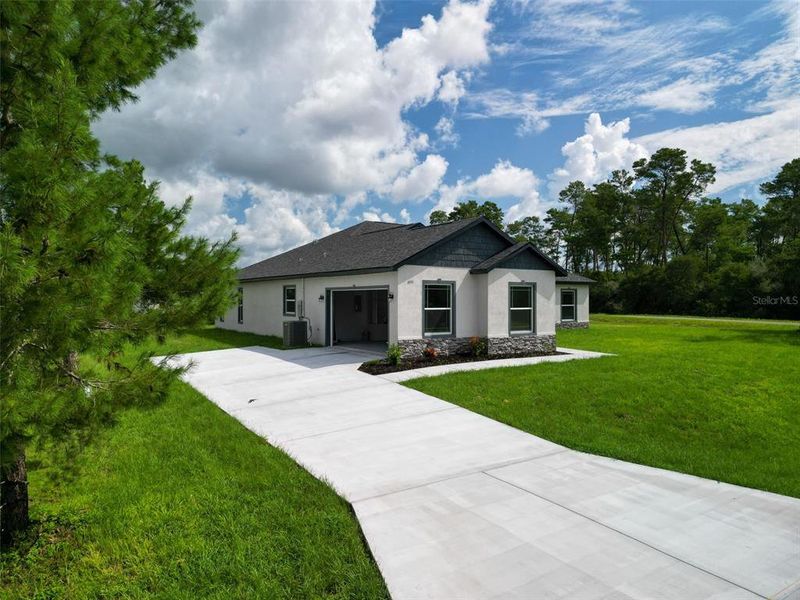 Front exterior of a new home in , Ocala, FL, highlighting curb appeal (Image 27). Front exterior of a new home in , Ocala, FL, highlighting curb appeal (Image 27).