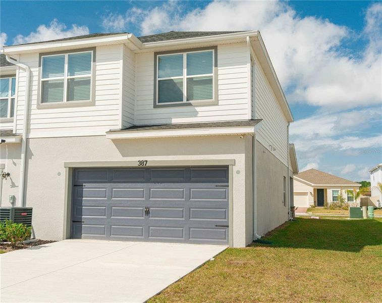 Front exterior of a new home in , St. Cloud, FL, highlighting curb appeal (Image 26). Front exterior of a new home in , St. Cloud, FL, highlighting curb appeal (Image 26).