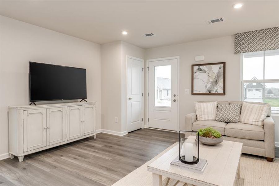 Representative furnished interior of a home built from the Tate by Ryan Homes in Middle Creek Village Coastal Cottages & Villas, Bolivia (Image 11).