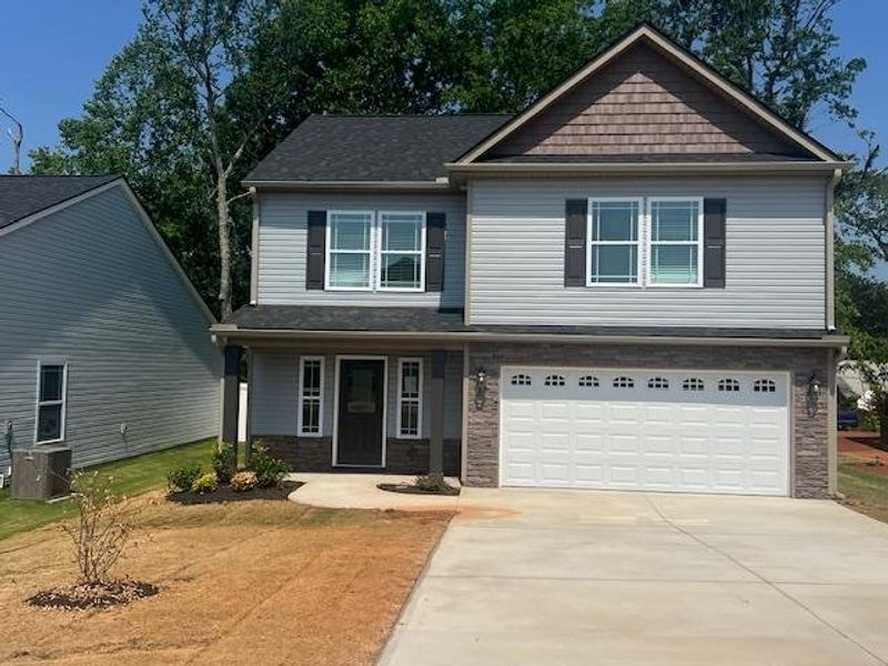 Front exterior of a new home in Cleveland Meadows, Spartanburg, SC, highlighting curb appeal (Image 1).