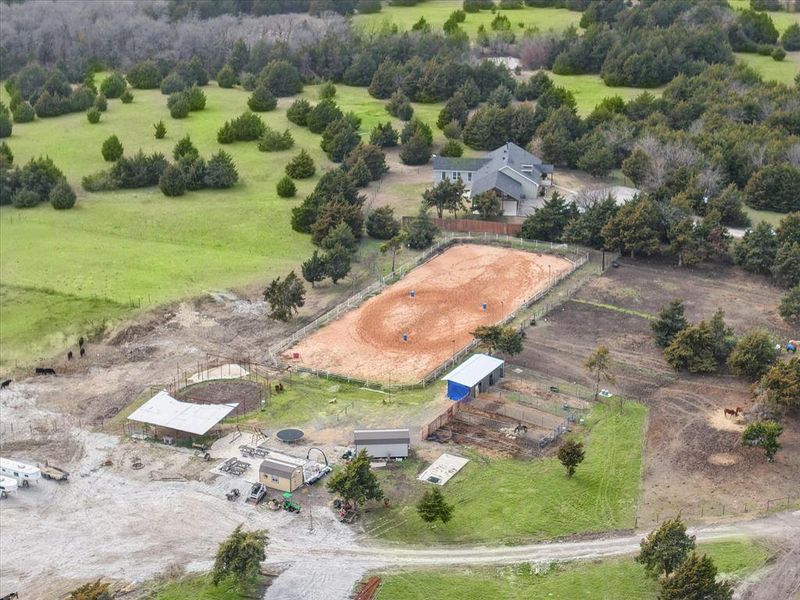 Birds eye view of property with a rural view