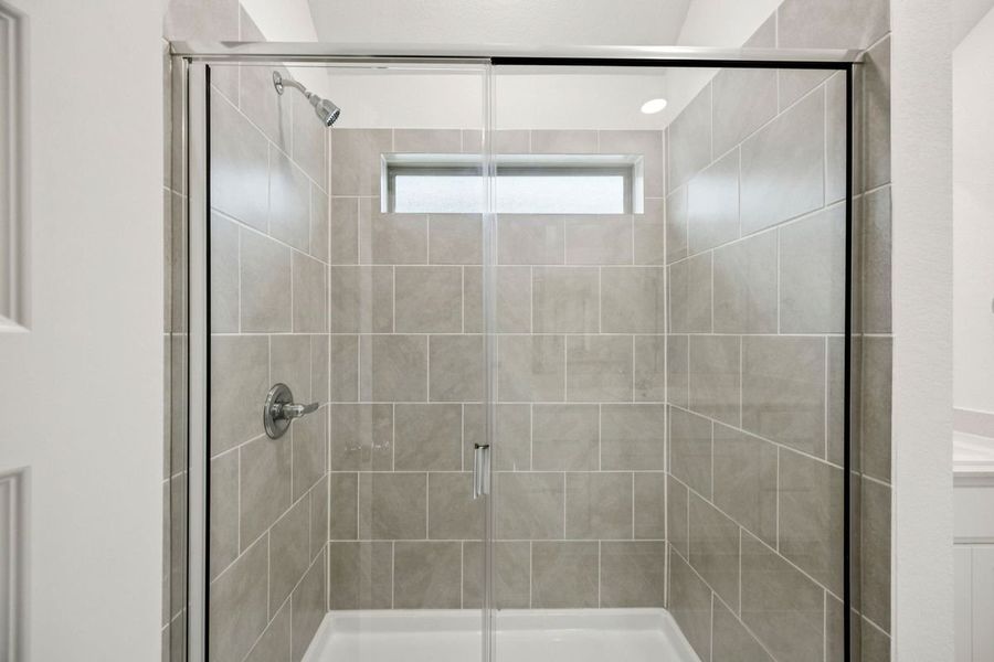 Primary Bathroom in the Spruce home plan by Trophy Signature Homes - REPRESENTATIVE PHOTO