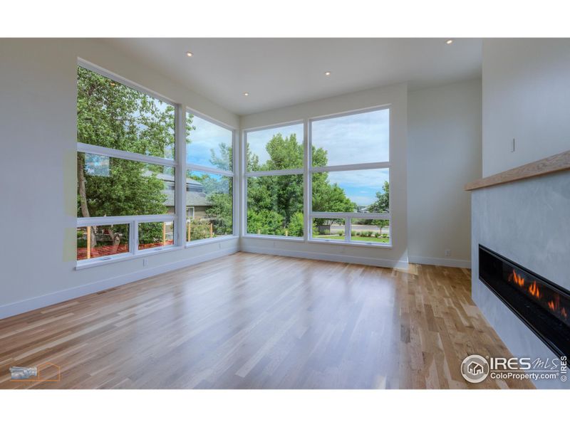 Living Room With 12' Ceiling And 6' Linear Mezzo Fireplace. Foothill Views.