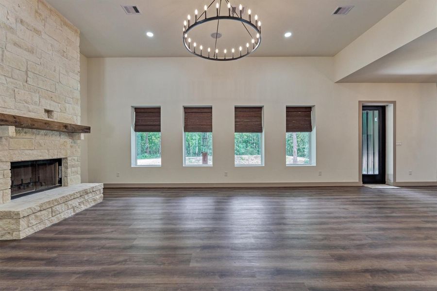 The spacious living area offers plenty of room for oversized furniture and decor, providing the flexibility to create a comfortable and inviting gathering space