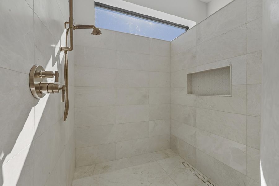Stunning walk in shower with window detail & rain shower