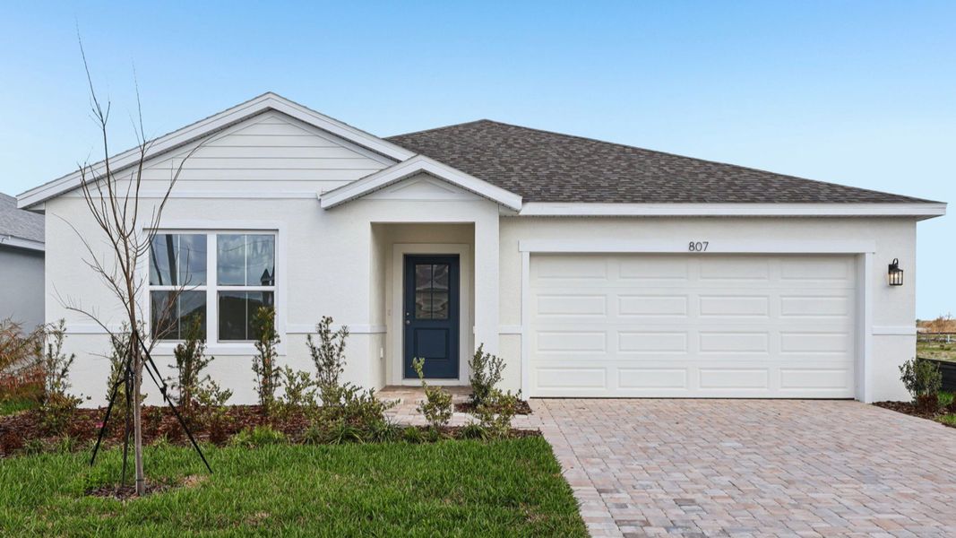 Representative exterior photo of a completed home built from the Baker by DRB Homes in Willowbrook North, Winter Haven, FL (Image 23).