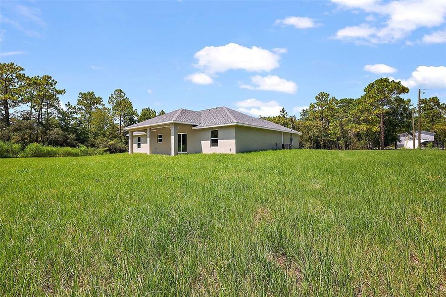 Front exterior of a new home in , Dunnellon, FL, highlighting curb appeal (Image 15).