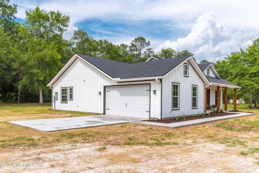 Front exterior of a new home in , Glen St. Mary, FL, highlighting curb appeal (Image 22).