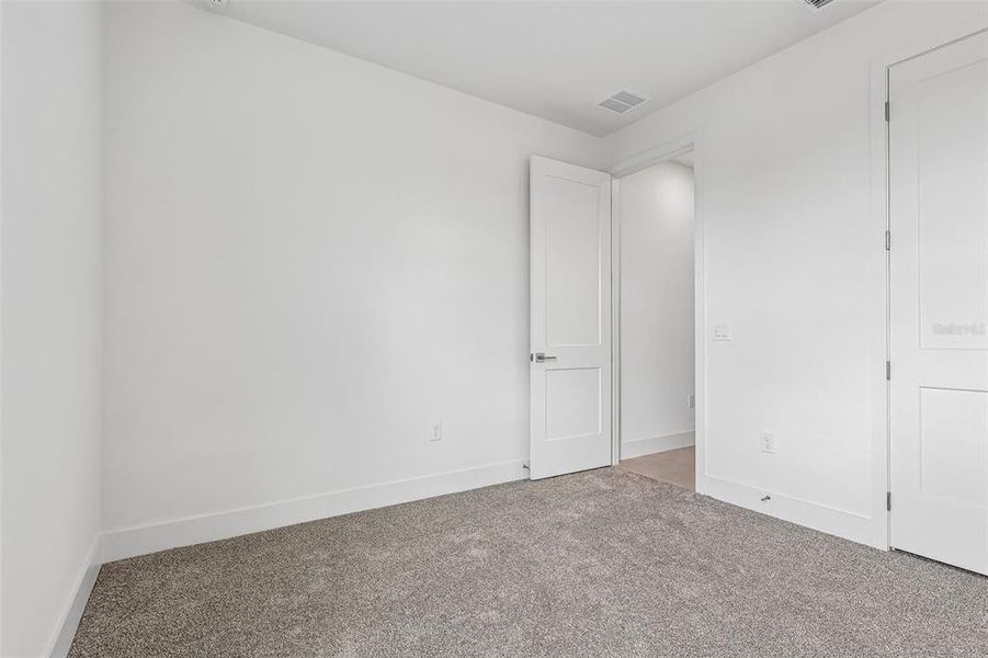Spacious, unfurnished interior of a new home in Lakeside at Satilla, St. Cloud (Image 31).