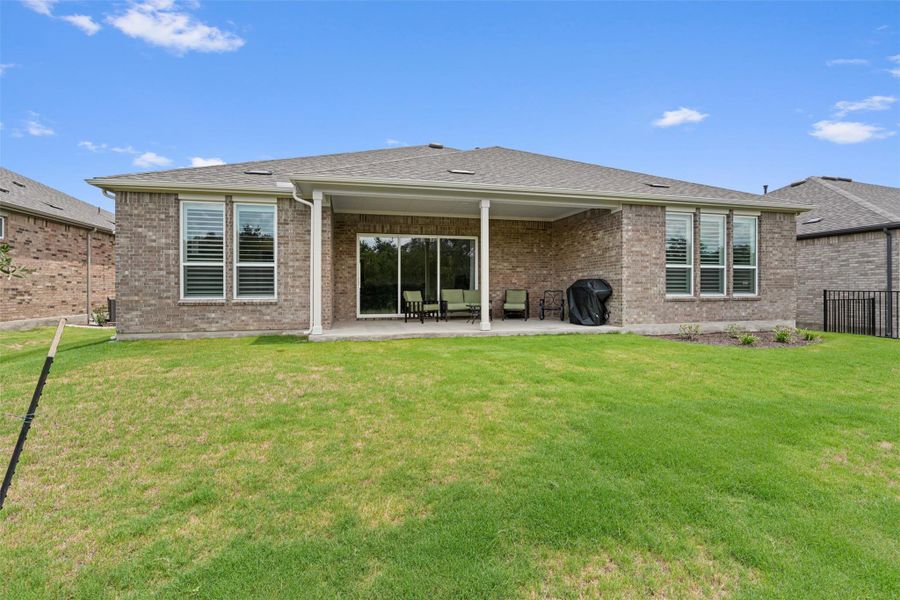 Front exterior of a new home in Sun City Texas, Georgetown, TX, highlighting curb appeal (Image 20).