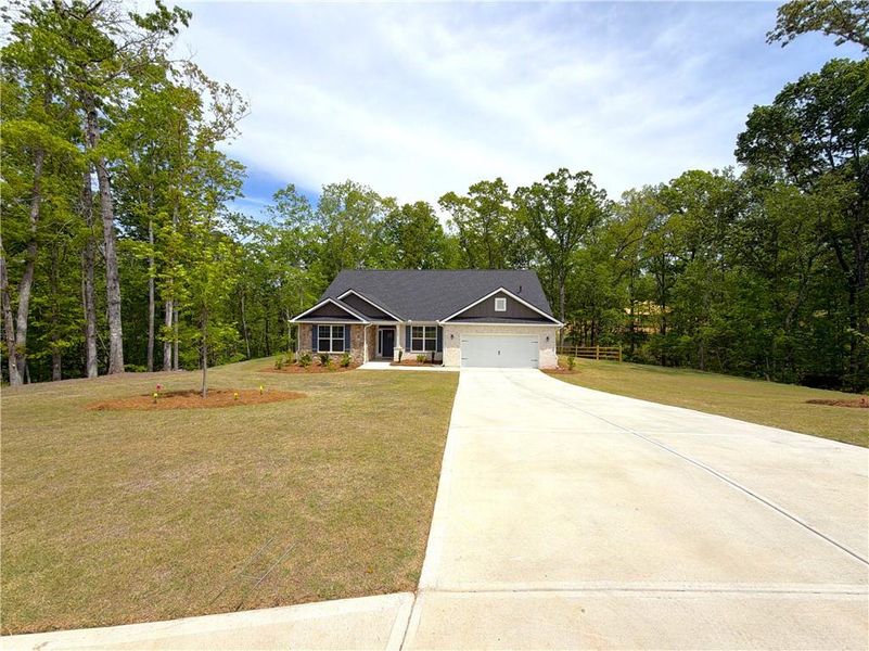 Front exterior of a new home in Tuscany Hills, Douglasville, GA, highlighting curb appeal (Image 18).