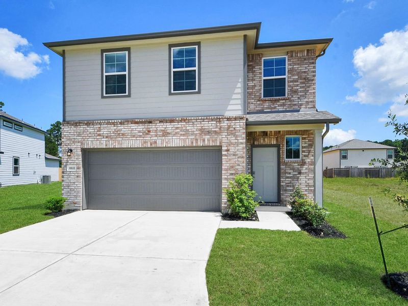 Front exterior of a new home in Liberty Estates, Cleveland, TX, highlighting curb appeal (Image 2). Front exterior of a new home in Liberty Estates, Cleveland, TX, highlighting curb appeal (Image 2).