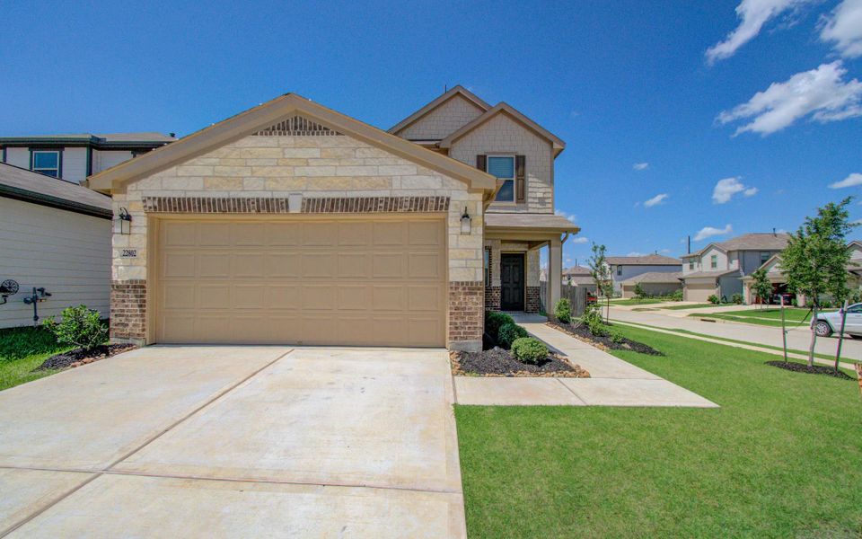 Front exterior of a new home in , Hockley, TX, highlighting curb appeal (Image 21).