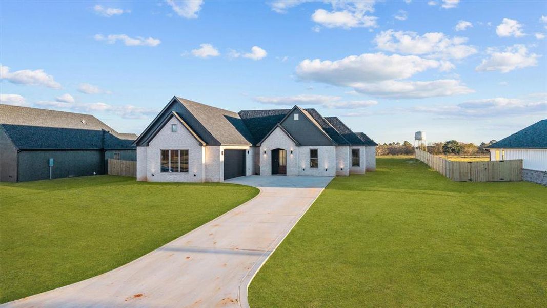 Front exterior of a new home in , Lindale, TX, highlighting curb appeal (Image 23).