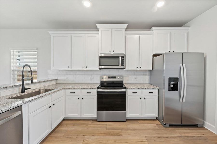 Furnished interior view inside a new home in Whisper Valley, Manor (Image 5).