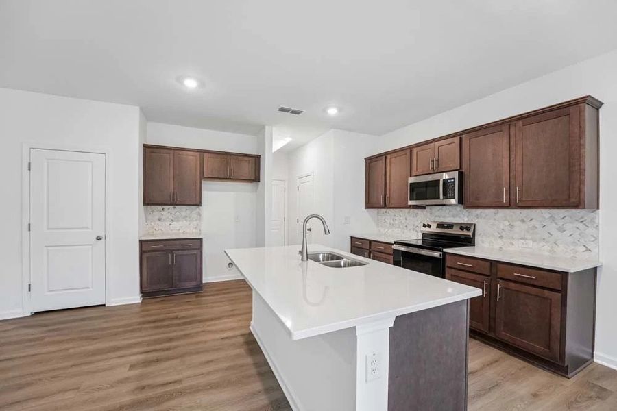 Kitchen Featuring Roosevelt Collection Finishes