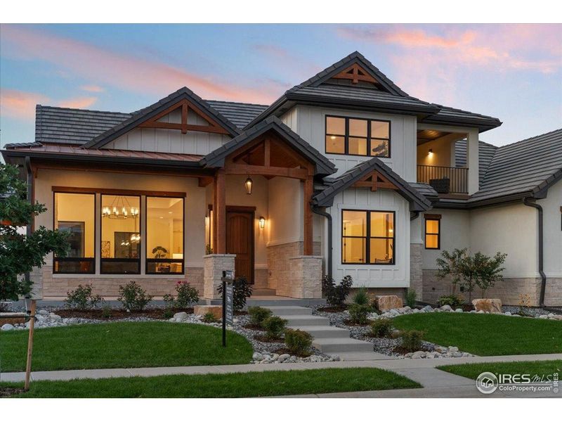 Front exterior of a new home in , Berthoud, CO, highlighting curb appeal (Image 21).
