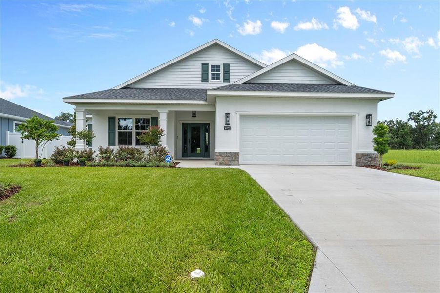 Front exterior of a new home in , Ocala, FL, highlighting curb appeal (Image 27).